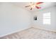 Bright bedroom with ceiling fan and carpet flooring at 2556 W Ironstone Ave, Apache Junction, AZ 85120