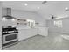 Modern kitchen featuring white cabinets, stainless steel appliances, and quartz countertops at 2848 E Adams St, Phoenix, AZ 85034