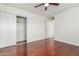 Well-lit bedroom with wood floors and mirrored closet doors at 2923 W Wethersfield Rd, Phoenix, AZ 85029