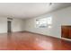 Bright and airy living room with hardwood floors and large windows at 2923 W Wethersfield Rd, Phoenix, AZ 85029