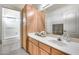 Clean bathroom with wood cabinets and a shower/tub combo at 36436 N 38Th St, Cave Creek, AZ 85331