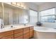 Bathroom with double sinks and a large soaking tub at 36436 N 38Th St, Cave Creek, AZ 85331