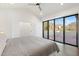 Main bedroom with sliding doors leading to a patio with mountain views at 3800 E Lincoln Dr # 55, Phoenix, AZ 85018