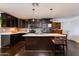 Modern kitchen featuring dark cabinetry, granite countertops, and an island at 3849 N 34Th St, Phoenix, AZ 85018