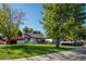 Cute ranch home with a well-manicured lawn and classic car at 4819 W Chicago St, Chandler, AZ 85226