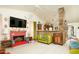 Retro living room with brick fireplace and vintage furniture at 4819 W Chicago St, Chandler, AZ 85226