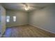 Bright bedroom featuring wood-look floors and a ceiling fan at 6115 N 12Th St # 1, Phoenix, AZ 85014