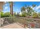 Balcony with view of trees and street at 7272 E Gainey Ranch Rd # 91, Scottsdale, AZ 85258