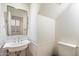 Small bathroom with pedestal sink at 7272 E Gainey Ranch Rd # 91, Scottsdale, AZ 85258