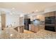 Kitchen boasts granite countertops and stainless steel appliances at 7272 E Gainey Ranch Rd # 91, Scottsdale, AZ 85258