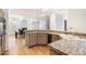 Kitchen with granite counters, stainless steel appliances, and breakfast bar at 7272 E Gainey Ranch Rd # 91, Scottsdale, AZ 85258