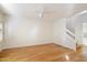 Bright living room with hardwood floors and staircase at 7272 E Gainey Ranch Rd # 91, Scottsdale, AZ 85258