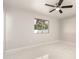 Well-lit bedroom featuring tile flooring and a large window at 7420 W Becker Ln, Peoria, AZ 85345