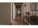 Elegant hallway with brick flooring and decorative accents at 8145 N 68Th St, Paradise Valley, AZ 85253