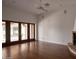 Living room with hardwood floors, fireplace, and French doors at 8145 N 68Th St, Paradise Valley, AZ 85253