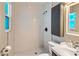 Modern bathroom with white tile shower and vanity at 1008 W Amelia Ave, Phoenix, AZ 85013