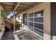 Covered entryway with slate tile flooring and garage access at 1008 W Amelia Ave, Phoenix, AZ 85013