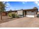 Ranch style home with attached garage and desert landscaping at 1008 W Amelia Ave, Phoenix, AZ 85013