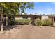 Mid-century modern home with a neatly landscaped front yard at 1008 W Amelia Ave, Phoenix, AZ 85013