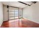 Bright garage with a modern glass door and epoxy flooring at 1008 W Amelia Ave, Phoenix, AZ 85013