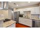 Updated kitchen featuring stainless steel appliances and granite counters at 1008 W Amelia Ave, Phoenix, AZ 85013