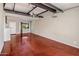 Spacious living area with high ceilings and exposed beams at 1008 W Amelia Ave, Phoenix, AZ 85013