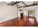 Open living area with kitchen bar and view to the backyard at 1008 W Amelia Ave, Phoenix, AZ 85013