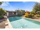 Inviting backyard pool with surrounding landscaping at 1008 W Amelia Ave, Phoenix, AZ 85013