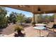 Covered patio with a gravel yard and desert landscaping at 10185 W Pasadena Dr, Casa Grande, AZ 85194