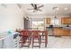 Kitchen features wood cabinets, stainless steel appliances, and a breakfast bar at 10246 W Catalina Dr, Arizona City, AZ 85123