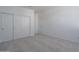 Spacious bedroom with double door closet and neutral carpeting at 1057 S 151St Ln, Goodyear, AZ 85338