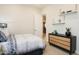 Cozy bedroom with a dresser and built-in shelves at 10893 N 156Th Dr, Surprise, AZ 85379