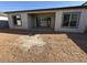 Home's back exterior and view of the backyard at 11510 E Utopia Ave, Mesa, AZ 85212