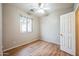 Simple bedroom with wood-look floors and neutral walls at 1225 N 36Th St # 1032, Phoenix, AZ 85008