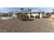 Large backyard with gravel landscaping and pergola at 13023 W Skyview Dr, Sun City West, AZ 85375