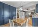 Charming dining area with wood table and chairs, near kitchen at 13023 W Skyview Dr, Sun City West, AZ 85375