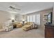 Living room with beige carpeting and comfortable seating at 13023 W Skyview Dr, Sun City West, AZ 85375