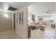 View of living room with comfy seating and a rocking chair at 13023 W Skyview Dr, Sun City West, AZ 85375