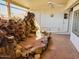 Covered patio with flagstone flooring, a rock waterfall feature, and ceiling fan at 13912 W Pavillion Dr, Sun City West, AZ 85375