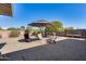 Relaxing backyard with patio furniture under a large umbrella at 14437 N Boswell Blvd, Sun City, AZ 85351