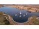 Aerial view of lake with fountains and landscaping at 17957 W Fairview St, Goodyear, AZ 85338