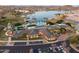 Aerial view of pool, clubhouse, and lake at 17957 W Fairview St, Goodyear, AZ 85338