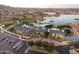 Luxury community clubhouse with pool, lake, and landscaped grounds at 17957 W Fairview St, Goodyear, AZ 85338