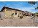 Backyard view of home, landscaping, and patio at 17957 W Fairview St, Goodyear, AZ 85338