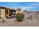 Backyard patio with seating area, fire pit, and pergola at 17957 W Fairview St, Goodyear, AZ 85338