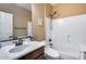 Clean bathroom, featuring a shower/tub combo, toilet and vanity with a sink at 17957 W Fairview St, Goodyear, AZ 85338