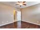 Bedroom with ceiling fan and access to bathroom at 17957 W Fairview St, Goodyear, AZ 85338