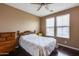Bright bedroom with a double bed, dresser, and window coverings at 17957 W Fairview St, Goodyear, AZ 85338