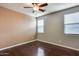 Bright bedroom with two windows and dark wood floors at 17957 W Fairview St, Goodyear, AZ 85338