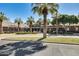 Community clubhouse with palm trees and seating at 17957 W Fairview St, Goodyear, AZ 85338